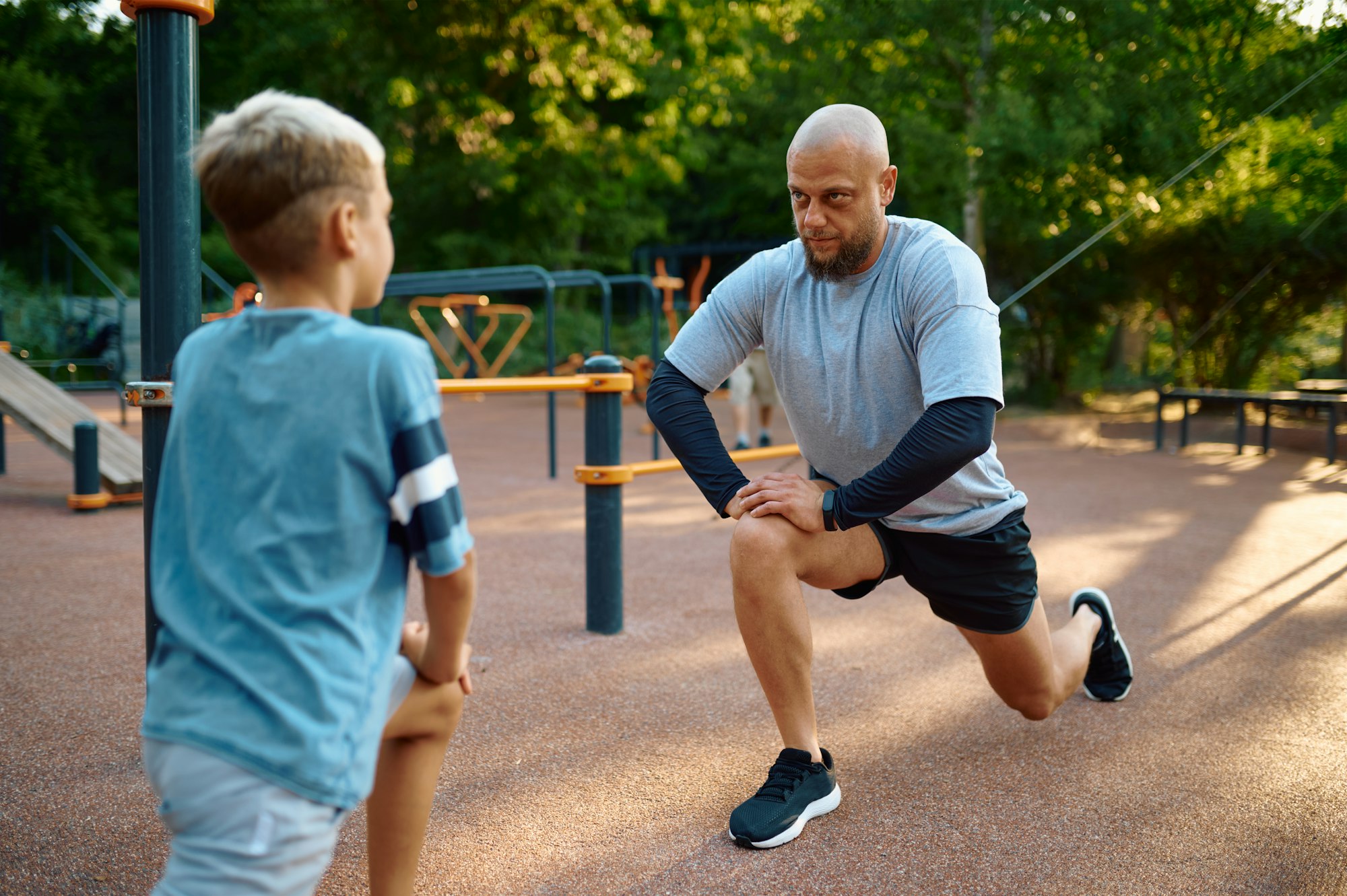 Dad and son doing exercise, sport training